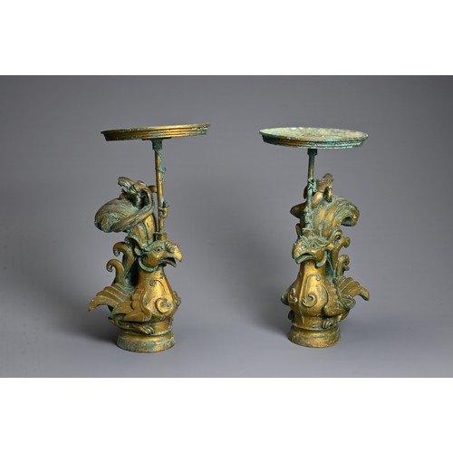 183 - A LARGE PAIR OF CHINESE ARCHAIC STYLE GILT BRONZE PHOENIX CANDLESTICKS. Elaborately cast in the form... 