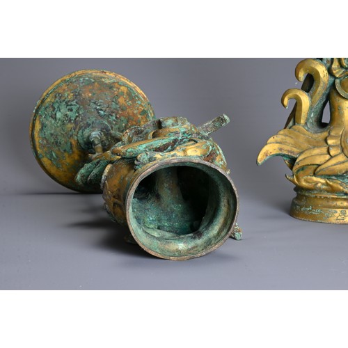 183 - A LARGE PAIR OF CHINESE ARCHAIC STYLE GILT BRONZE PHOENIX CANDLESTICKS. Elaborately cast in the form... 