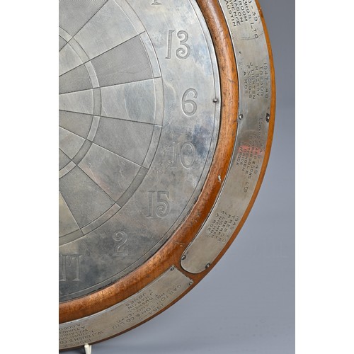 272 - A SILVER DARTBOARD TROPHY, CHARLES S. GREEN & CO, HALLMARKED, BIRMINGHAM 1935. Mounted on an oak bas... 