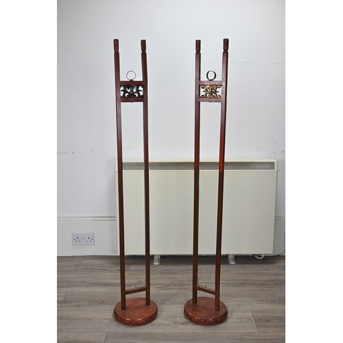 201 - A LARGE PAIR OF CHINESE RED LACQUERED HANGING CANDLESTICK HOLDER STANDS, EARLY 20TH CENTURY. Each ci... 