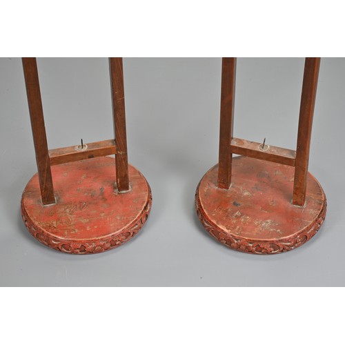 201 - A LARGE PAIR OF CHINESE RED LACQUERED HANGING CANDLESTICK HOLDER STANDS, EARLY 20TH CENTURY. Each ci... 