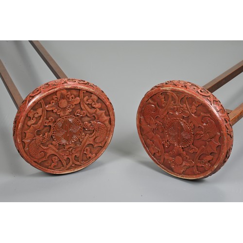 201 - A LARGE PAIR OF CHINESE RED LACQUERED HANGING CANDLESTICK HOLDER STANDS, EARLY 20TH CENTURY. Each ci... 