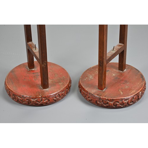 201 - A LARGE PAIR OF CHINESE RED LACQUERED HANGING CANDLESTICK HOLDER STANDS, EARLY 20TH CENTURY. Each ci... 