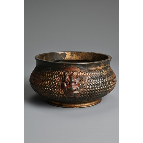 43 - A CHINESE GILT AND RED LACQUER BRONZE CENSER. Of squat form with a basket weave exterior and twin li... 