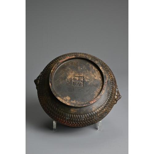 43 - A CHINESE GILT AND RED LACQUER BRONZE CENSER. Of squat form with a basket weave exterior and twin li... 