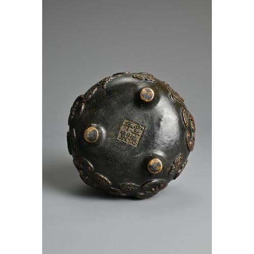 156 - A CHINESE BRONZE TRIPOD CENSER. Of squat globular form decorated in relief with bats and clouds. Apo... 