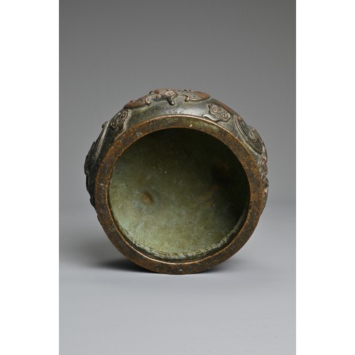 156 - A CHINESE BRONZE TRIPOD CENSER. Of squat globular form decorated in relief with bats and clouds. Apo... 