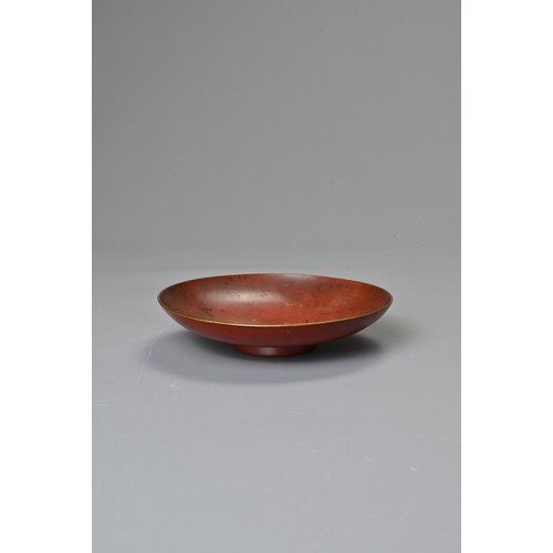 245 - A JAPANESE MEIJI PERIOD (1868-1912) RED LACQUER SAKE CUP. Of circular shallow form, decorated in gil... 