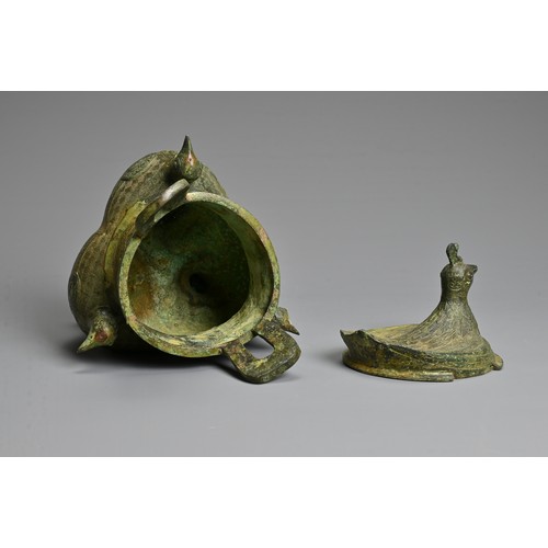 241 - A CHINESE ARCHAIC STYLE BRONZE TRIPOD VESSEL. Bird form finials to each leg with a bird form cover, ... 