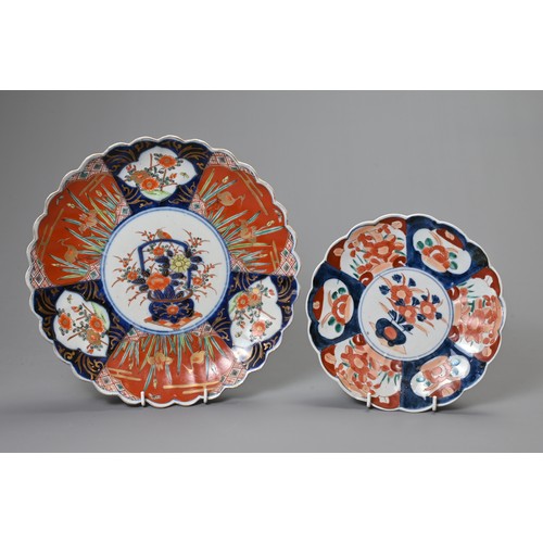 262 - TWO JAPANESE IMARI SCALLOPED CIRCULAR DISHES AND A PAIR OF PLATES, 19TH CENTURY. The dishes painted ... 