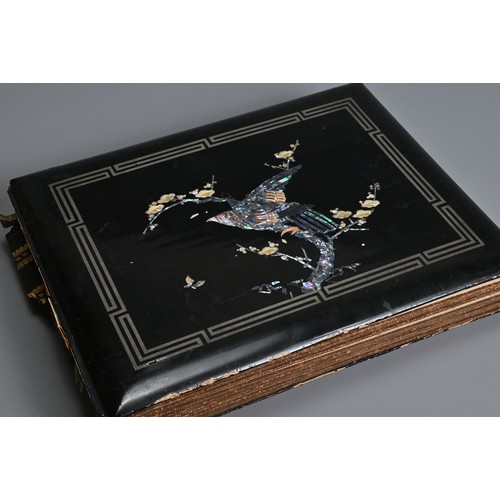 251 - A JAPANESE LACQUER PHOTOGRAPH ALBUM, EARLY 20TH CENTURY. The cover inlaid and painted featuring a bi... 