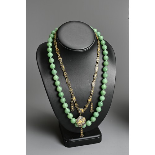 279 - THREE NECKLACES. To include a ceramic beaded necklace; A jade stone beaded necklace mounted with sil... 