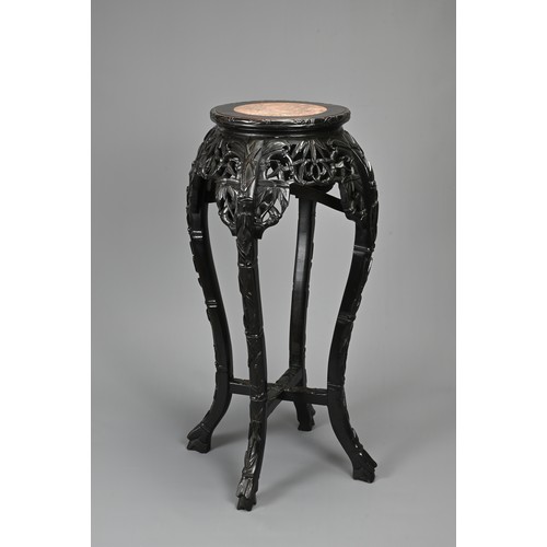 208 - A CHINESE HARDWOOD JARDINIERE STAND, 19/20TH CENTURY. Carved in relief with s shaped faux bamboo leg... 