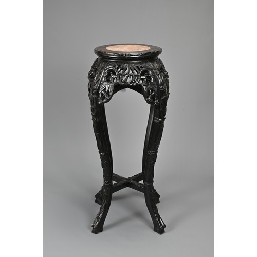 208 - A CHINESE HARDWOOD JARDINIERE STAND, 19/20TH CENTURY. Carved in relief with s shaped faux bamboo leg... 