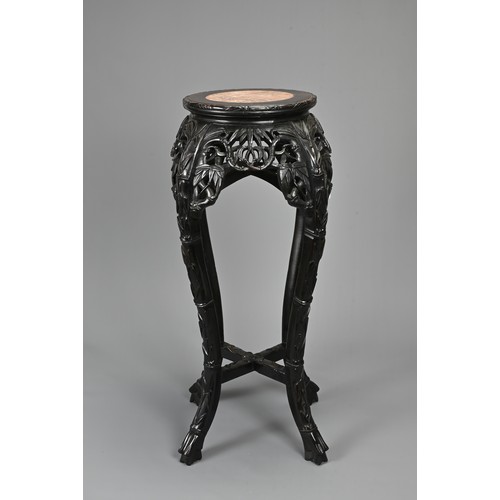 208 - A CHINESE HARDWOOD JARDINIERE STAND, 19/20TH CENTURY. Carved in relief with s shaped faux bamboo leg... 