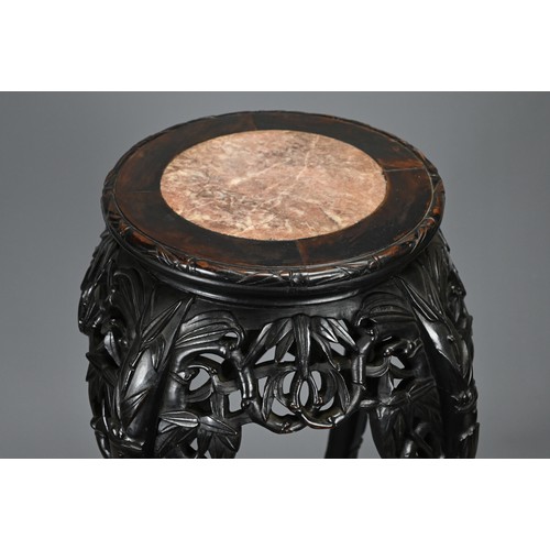 208 - A CHINESE HARDWOOD JARDINIERE STAND, 19/20TH CENTURY. Carved in relief with s shaped faux bamboo leg... 