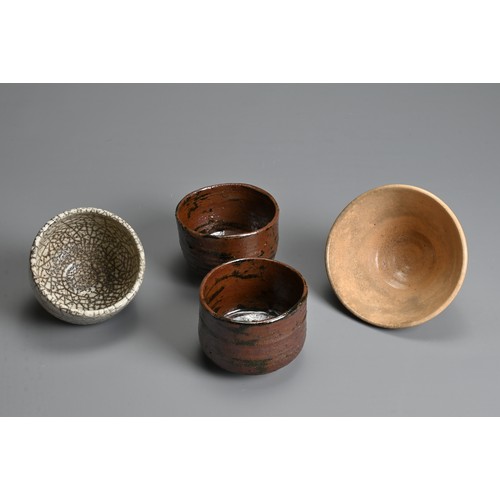 239 - FOUR JAPANESE SETO TYPE POTTERY BOWLS, 19/20TH CENTURY. To include two brown bowls each with a wax s... 