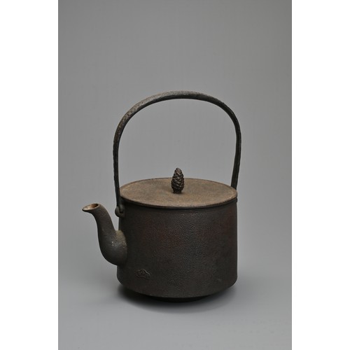 236 - A JAPANESE CAST IRON TEAPOT, EARLY 20TH CENTURY. Of cylindrical form with handle, widening at the ba... 