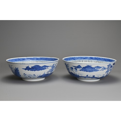 1 - A LARGE PAIR OF CHINESE BLUE AND WHITE PORCELAIN BOWLS, LATE 19TH CENTURY. Each decorated with build... 