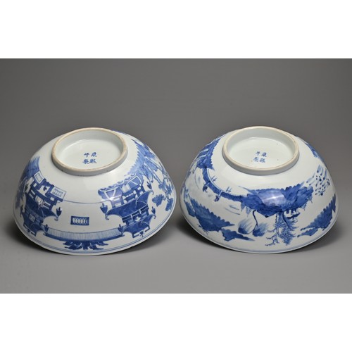 1 - A LARGE PAIR OF CHINESE BLUE AND WHITE PORCELAIN BOWLS, LATE 19TH CENTURY. Each decorated with build... 