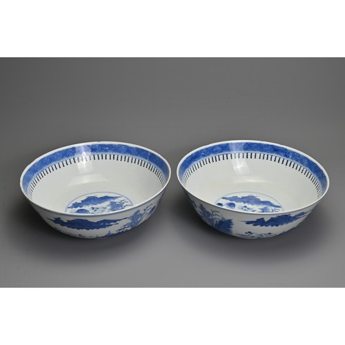 1 - A LARGE PAIR OF CHINESE BLUE AND WHITE PORCELAIN BOWLS, LATE 19TH CENTURY. Each decorated with build... 