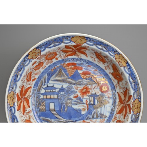 4 - A LARGE CHINESE IMARI PORCELAIN BOWL, 18TH CENTURY. Decorated with pagodas in a coastal scene in und... 