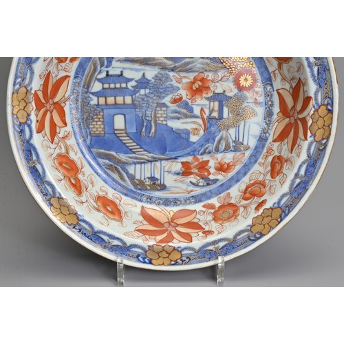 4 - A LARGE CHINESE IMARI PORCELAIN BOWL, 18TH CENTURY. Decorated with pagodas in a coastal scene in und... 