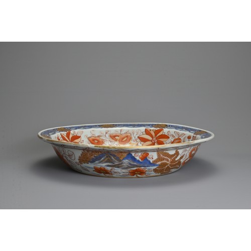 4 - A LARGE CHINESE IMARI PORCELAIN BOWL, 18TH CENTURY. Decorated with pagodas in a coastal scene in und... 