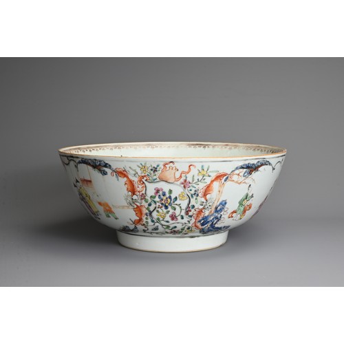 12 - A CHINESE FAMILLE ROSE PORCELAIN PUNCH BOWL, 18TH CENTURY. Decorated with figures in a courtyard sce... 