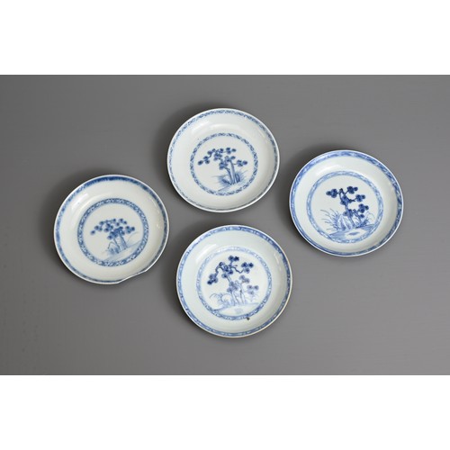 24 - FOUR CHINESE BLUE AND WHITE PORCELAIN SAUCERS, 18TH CENTURY. Each finely potted, decorated with pine... 