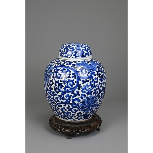 31 - A CHINESE BLUE AND WHITE PORCELAIN JAR AND COVER, LATE 19TH. Decorated with continuous lotus scrolls... 