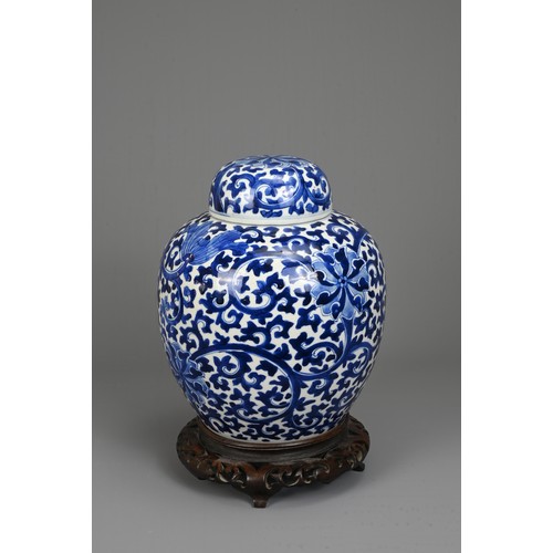 31 - A CHINESE BLUE AND WHITE PORCELAIN JAR AND COVER, LATE 19TH. Decorated with continuous lotus scrolls... 