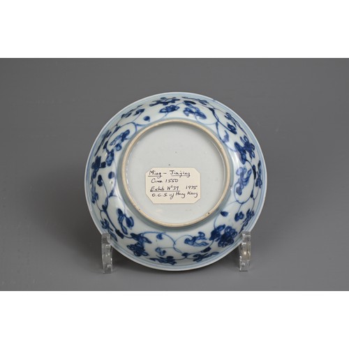 35 - A CHINESE BLUE AND WHITE PORCELAIN DISH, MING DYNASTY. Decorated with a twisted peach tree in garden... 