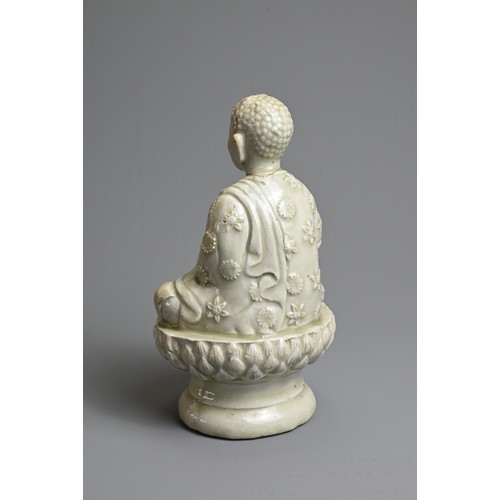 44 - AN UNUSUAL CHINESE PALE CELADON GLAZED PORCELAIN FIGURE OF BUDDHA, 17/18TH CENTURY. Seated on a rais... 