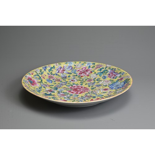 55 - A LARGE CHINESE MILLEFLEUR DECORATED PORCELAIN DISH, 20TH CENTURY. Decorated with various floral blo... 