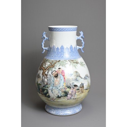 62 - A CHINESE FAMILLE ROSE ENAMELLED PORCELAIN HU JAR, 20TH CENTURY. With twin dragon handles, decorated... 