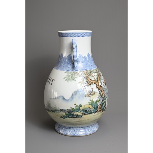 62 - A CHINESE FAMILLE ROSE ENAMELLED PORCELAIN HU JAR, 20TH CENTURY. With twin dragon handles, decorated... 