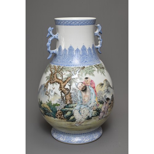 62 - A CHINESE FAMILLE ROSE ENAMELLED PORCELAIN HU JAR, 20TH CENTURY. With twin dragon handles, decorated... 