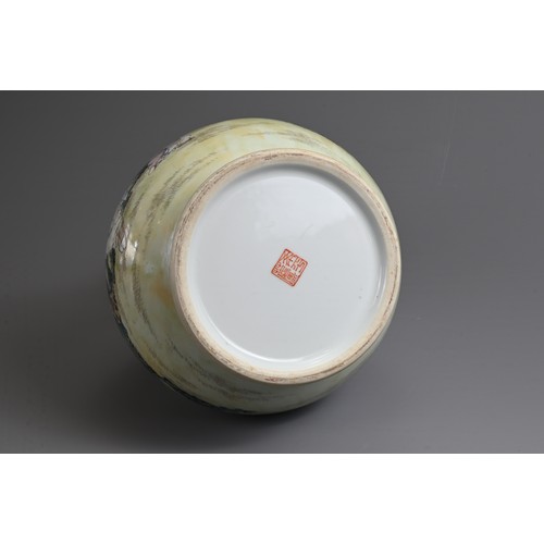 62 - A CHINESE FAMILLE ROSE ENAMELLED PORCELAIN HU JAR, 20TH CENTURY. With twin dragon handles, decorated... 