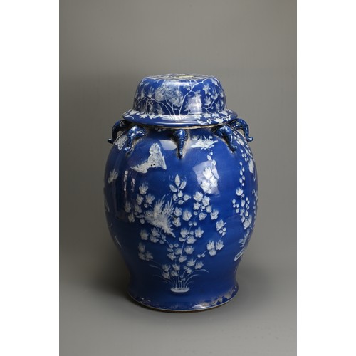 61 - A LARGE CHINESE BLUE AND WHITE PORCELAIN JAR AND COVERS, 19/20TH CENTURY. White enamel on a blue gro... 