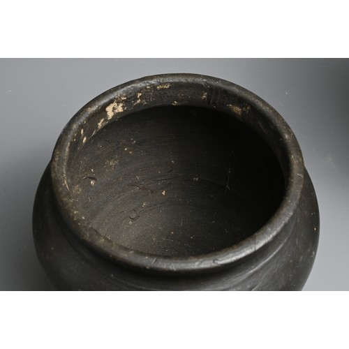 210 - THREE RARE CHINESE BURNISHED BLACK POTTERY JARS, YUAN DYNASTY (1279 – 1368). Comprising two tall cyl... 