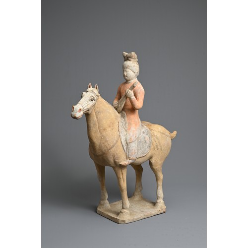 206 - A CHINESE PAINTED POTTERY HORSE WITH MUSICIAN, TANG DYNASTY (618-907). The horse standing four squar... 