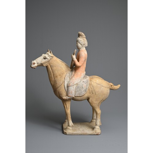 206 - A CHINESE PAINTED POTTERY HORSE WITH MUSICIAN, TANG DYNASTY (618-907). The horse standing four squar... 