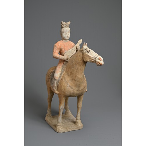 206 - A CHINESE PAINTED POTTERY HORSE WITH MUSICIAN, TANG DYNASTY (618-907). The horse standing four squar... 