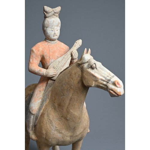 206 - A CHINESE PAINTED POTTERY HORSE WITH MUSICIAN, TANG DYNASTY (618-907). The horse standing four squar... 