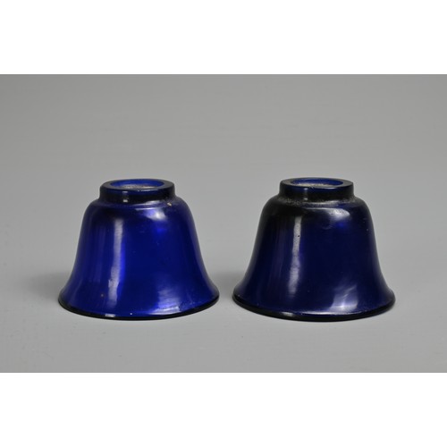 274 - A PAIR OF CHINESE BLUE PEKING GLASS WINE CUPS, LATE QING DYNASTY. Bell shaped cups on thick circular... 