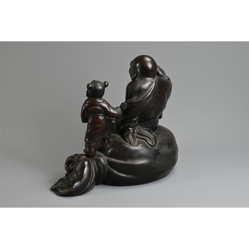 307 - A JAPANESE LATE MEIJI PERIOD (1868-1912) BRONZE OKIMONO OF HOTEI AND KARAKO BY HONMA TAKUSEI III (18... 