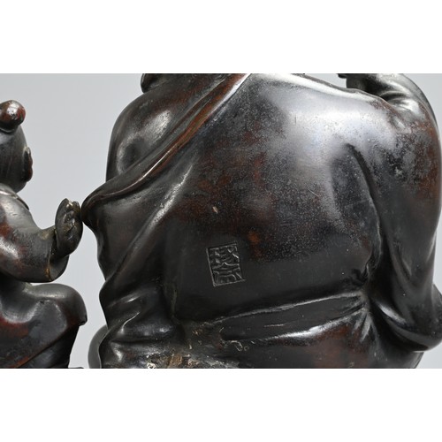 307 - A JAPANESE LATE MEIJI PERIOD (1868-1912) BRONZE OKIMONO OF HOTEI AND KARAKO BY HONMA TAKUSEI III (18... 