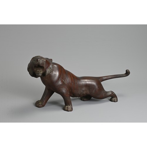 306 - A LATE 19TH/EARLY 20TH CENTURY JAPANESE BRONZE OKIMONO OF A TIGER BY NOBUMITSU. Naturalistically cas... 