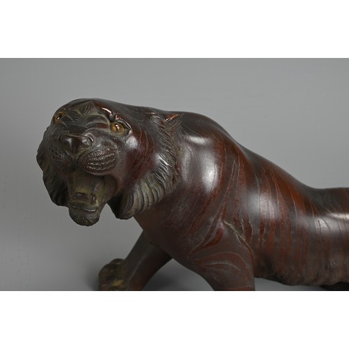 306 - A LATE 19TH/EARLY 20TH CENTURY JAPANESE BRONZE OKIMONO OF A TIGER BY NOBUMITSU. Naturalistically cas... 